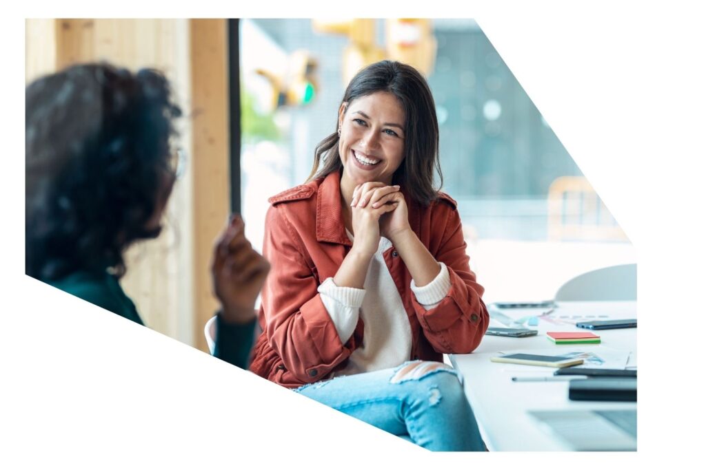 Two women having a conversation Finance