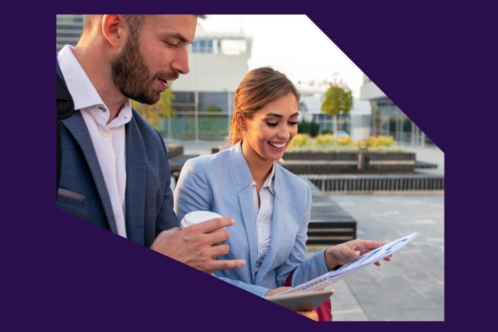 Man and woman discussing with coffee SLS Advisory