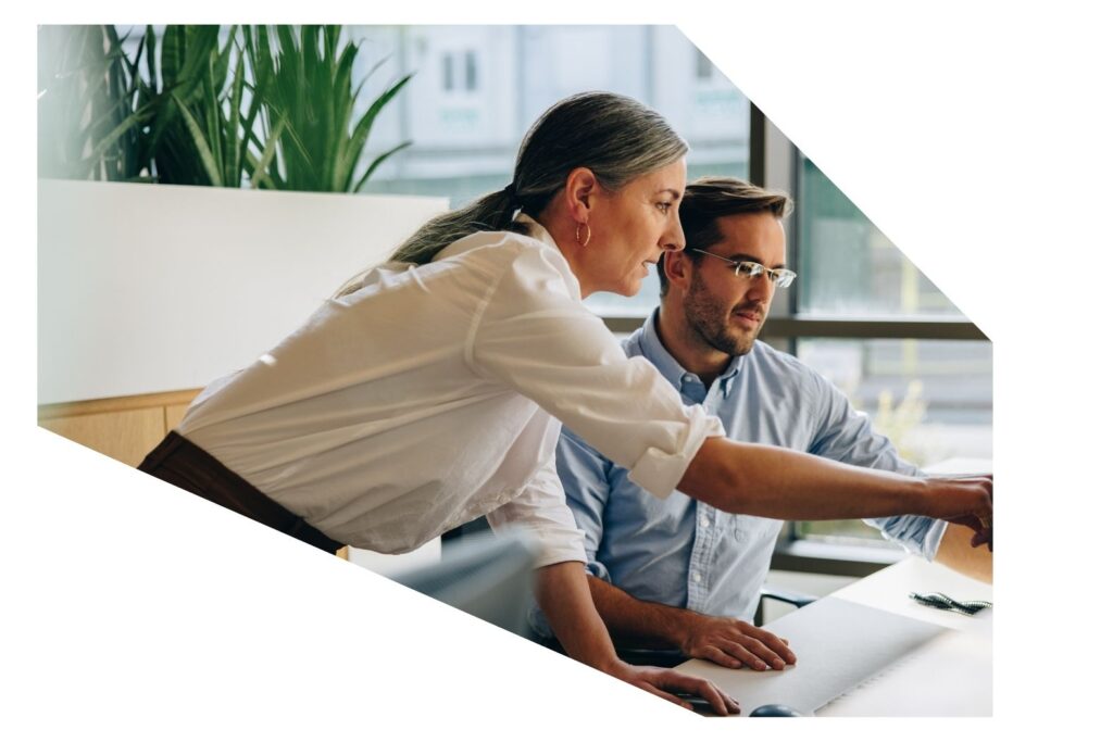 Woman and man working in the office SLS Advisory