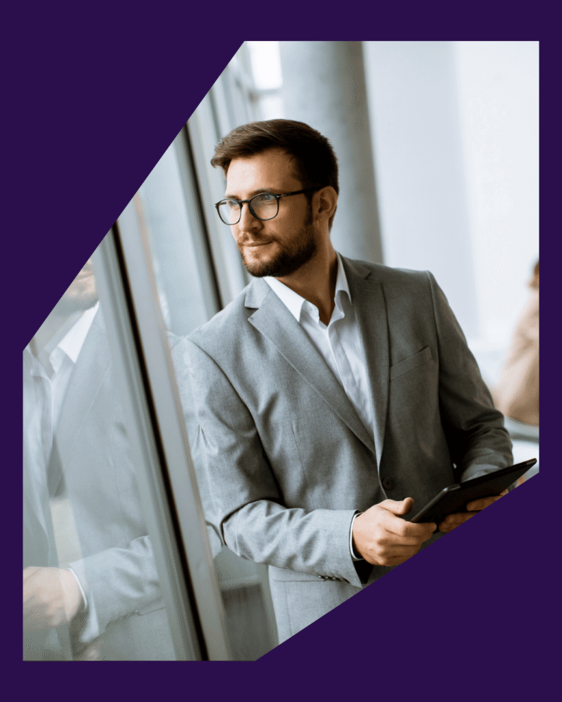 Business man looking out window SLS Advisory