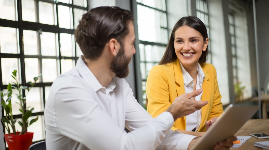 Man giving payday super advice to woman